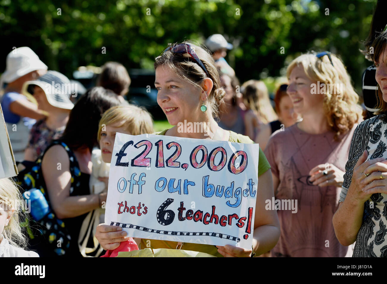 Brighton, UK. 26th May, 2017. Parents from Brighton and Hove schools take part in the "Save Our Schools" (SOS) campaign protest rally at The Level in Brighton today against education cuts by the governement Credit: Simon Dack/Alamy Live News Stock Photo