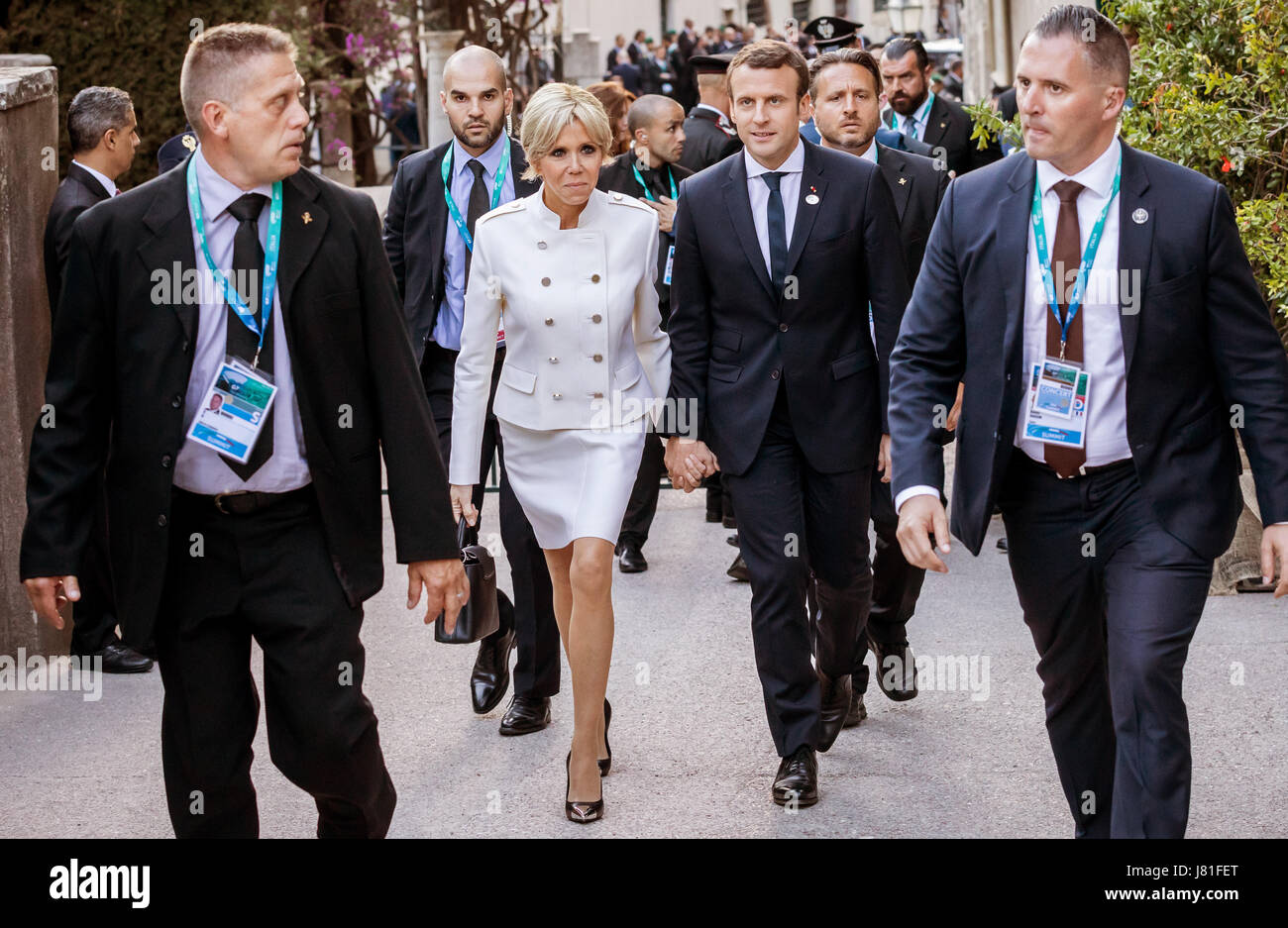 Taormina, Italy. 26th May, 2017. France's president Emmanuel Macron and his wife Brigitte can be seen on their way to a concert at the Greek Theatre in Taormina, Italy, 26 May 2017. The heads of goverment of the G7 member states have gathered for the summit to be held from 26 May to 27 May 2017. Photo: Michael Kappeler/dpa/Alamy Live News Stock Photo
