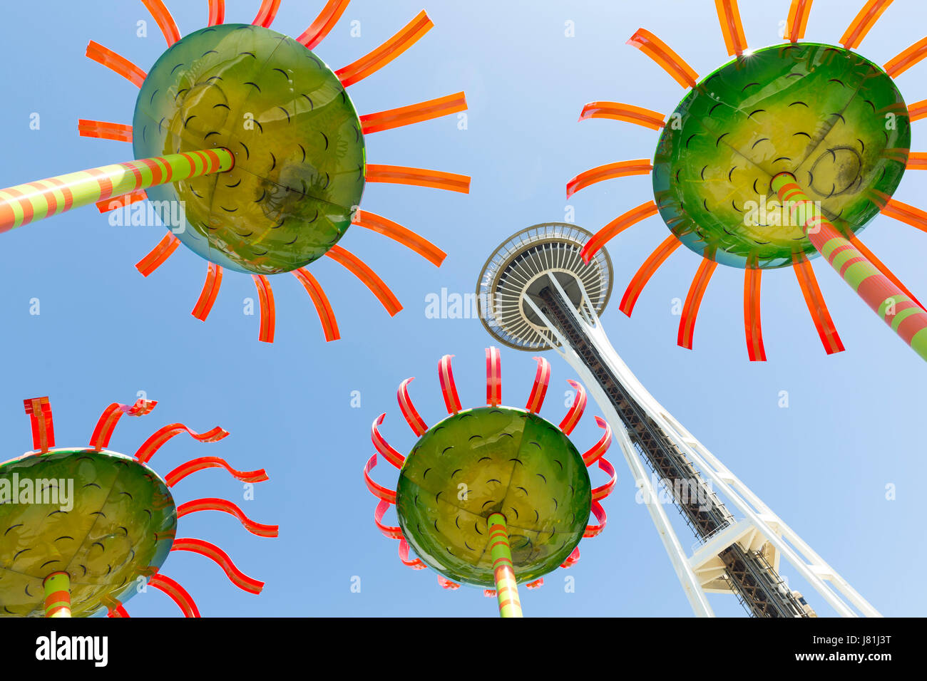 Seattle, Washington, USA. 26th May, 2017. The Space Needle framed by artist Dan Corson’s monumental floral sculptures “Sonic Boom” during the Northwest Folklife Festival. The annual festival of ethnic, folk, and traditional art, crafts, and music that takes place over the Memorial Day weekend in Seattle, Washington at Seattle Center. Founded in 1971 by the Seattle Folklore Society, the National Park Service and the National Folk Festival Association. Credit: Paul Gordon/Alamy Live News Stock Photo