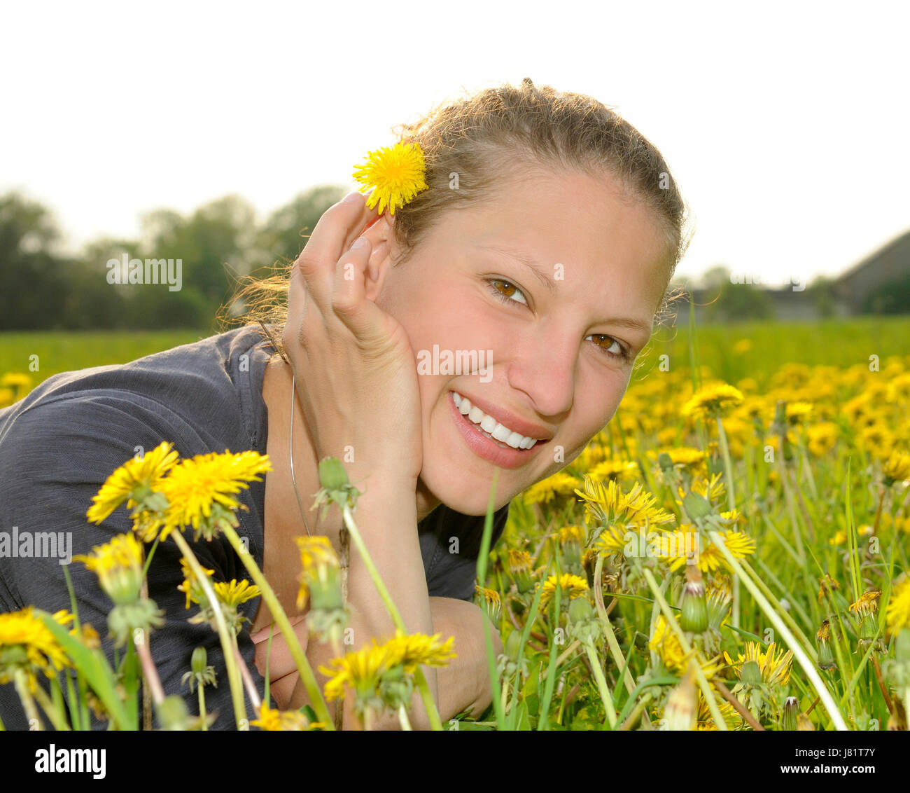 young woman on a flower meadow Stock Photo