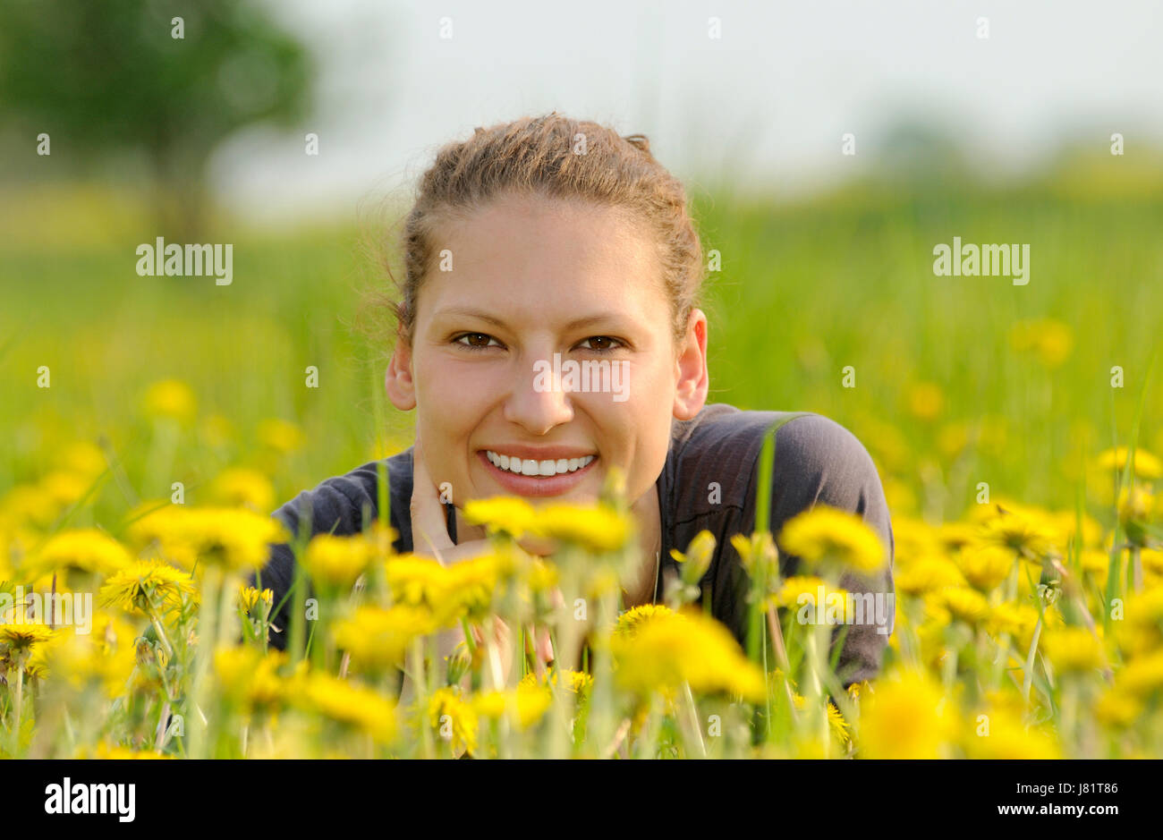 young woman on a flower meadow Stock Photo
