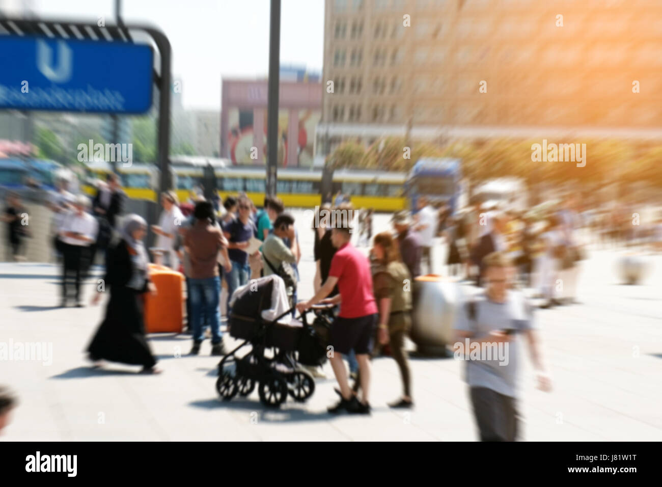 picture with motion blur of a crowd of people crossing a city street at the pedestrian zone Stock Photo