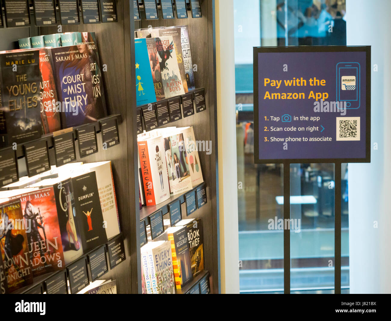 Customers shop and browse in the new Amazon Books in the Time Warner ...