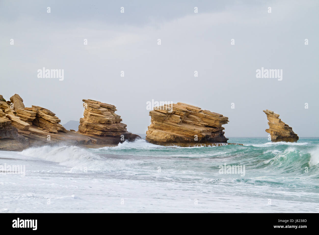 Triopetra, cliffs of platy sandstone on Crete, Greece Stock Photo