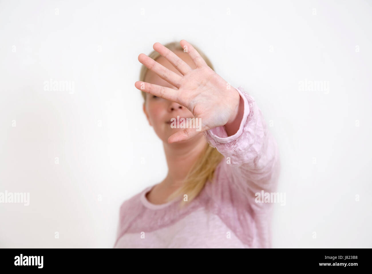 woman isolated no defense ban young younger stop woman earnest hand isolated Stock Photo