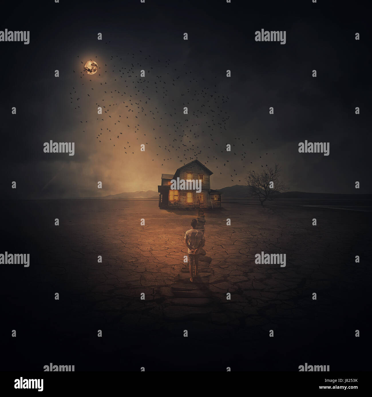 Surreal and spooky background as a young boy following the pathway, along the cracked desert ground, going to a wood house below the night sky moonlig Stock Photo