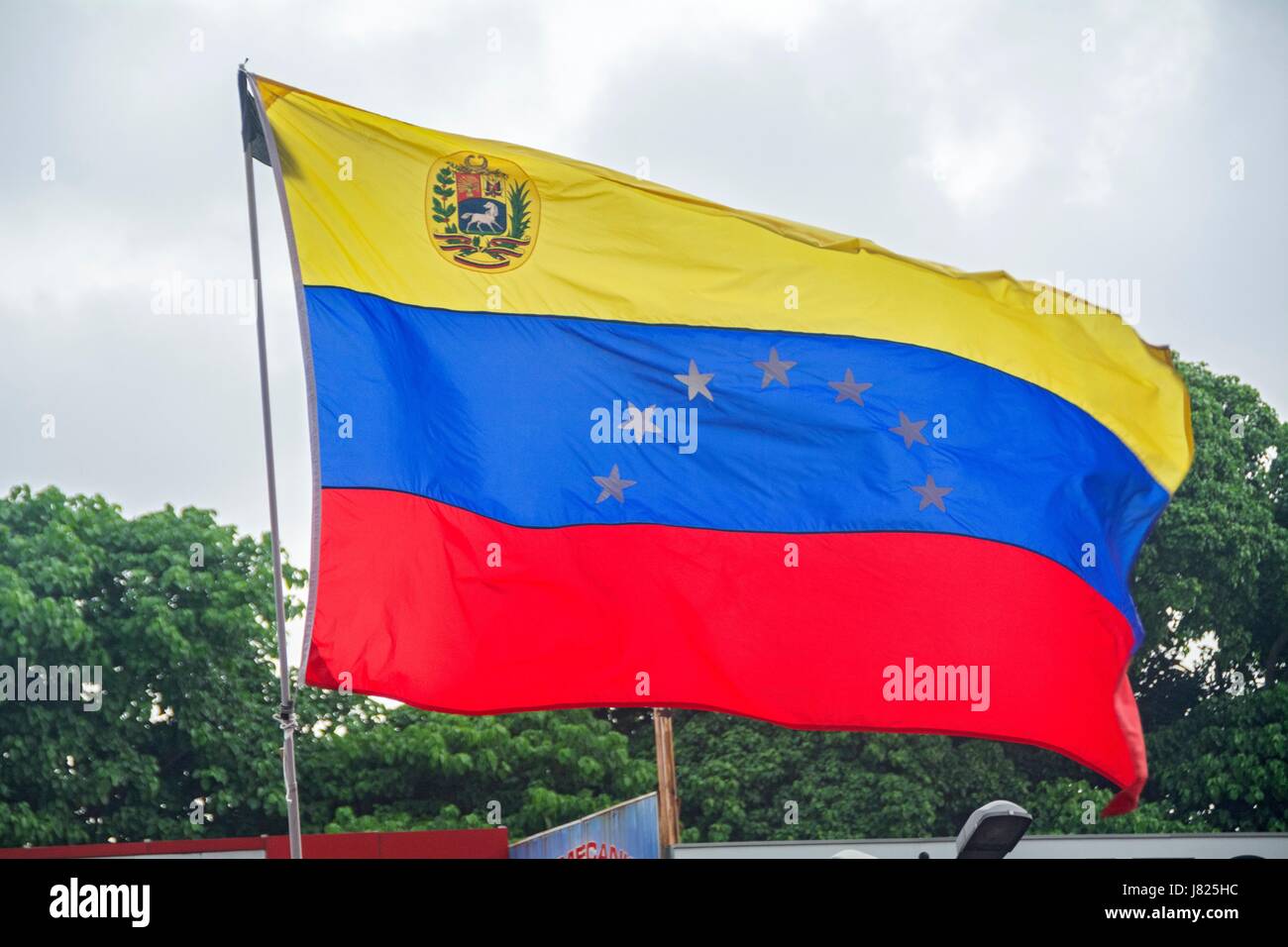 Flag of Venezuela in the march of the lights. Thousands of opponents of the Venezuelan government, Nicolas Maduro, held a tribute to the victims of th Stock Photo