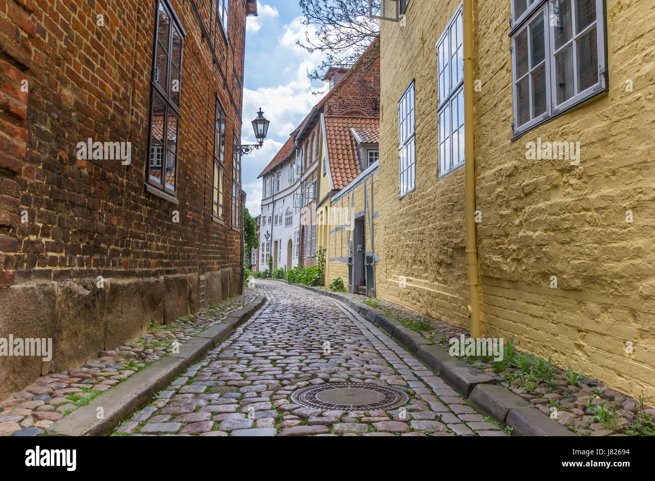 Cobblestoned street with colorful houses in Luneburg, Germany Stock Photo