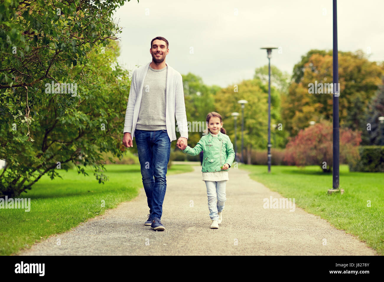 happy family walking in summer park Stock Photo - Alamy