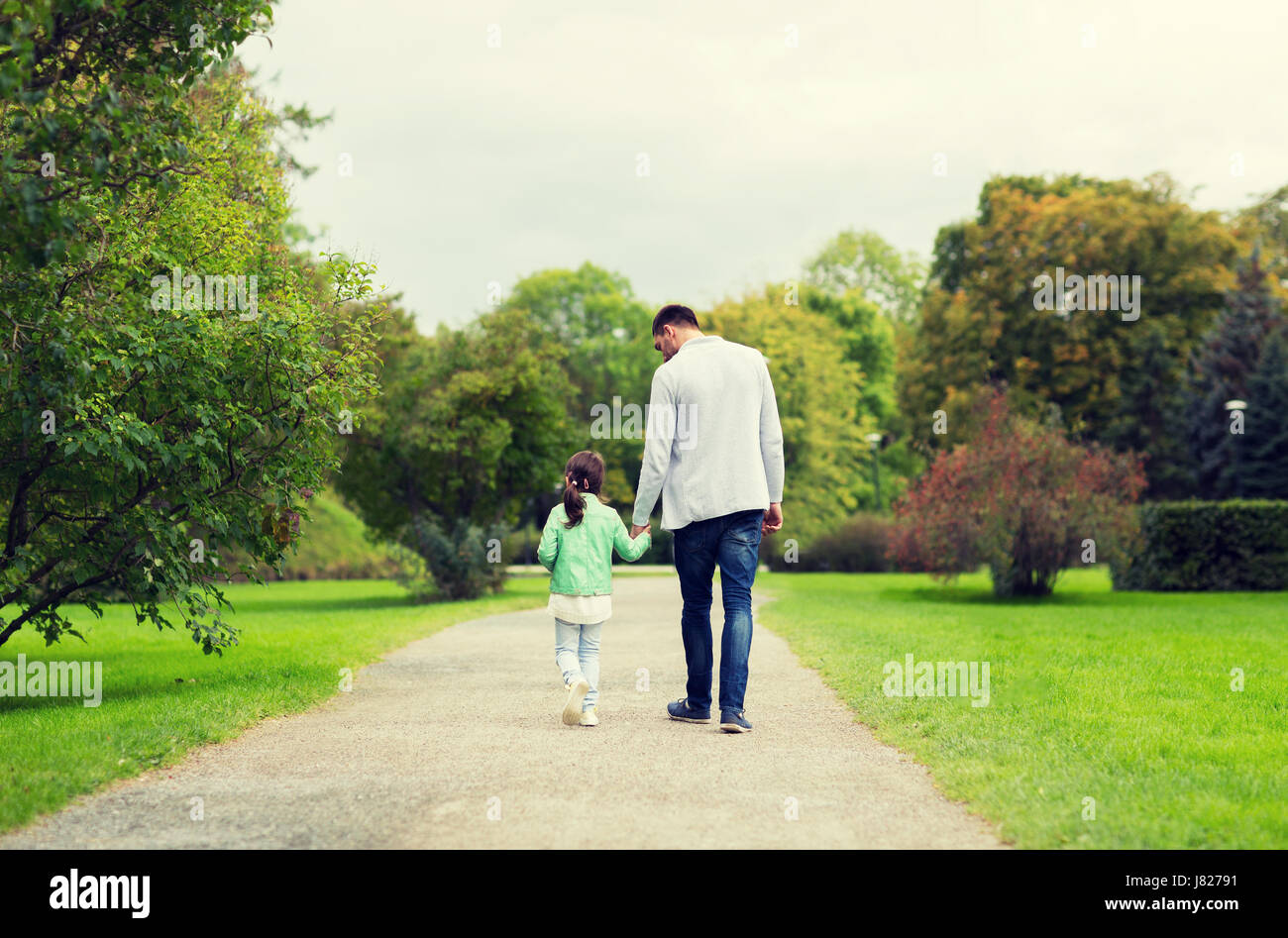 happy family walking in summer park Stock Photo - Alamy