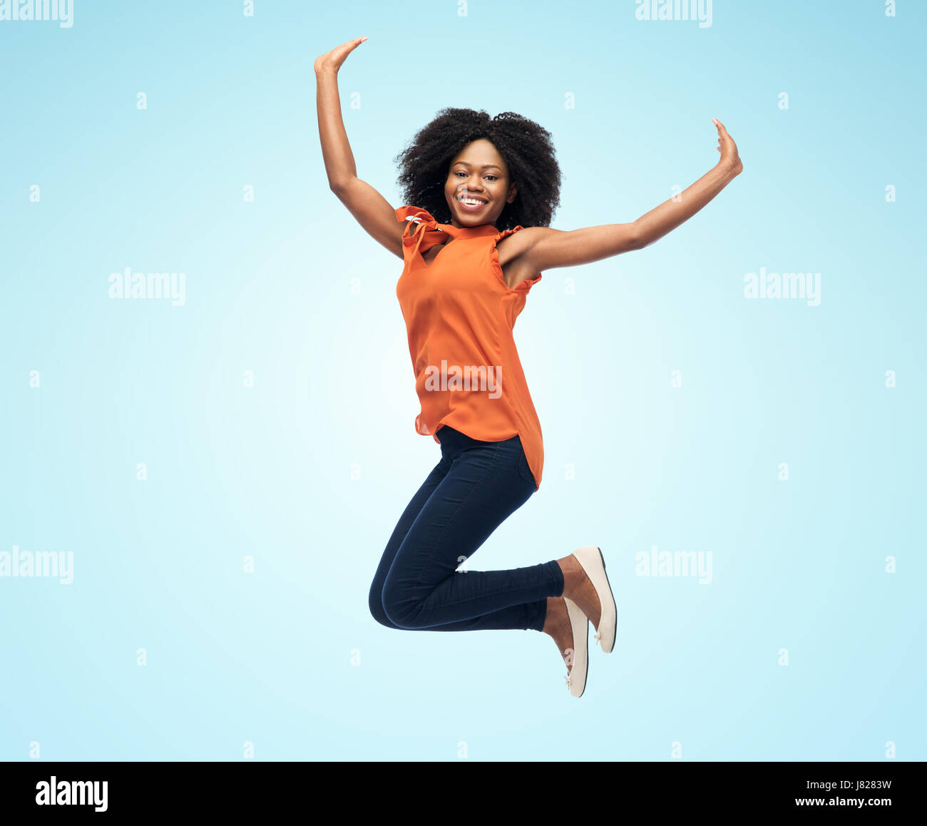happy african american woman jumping over white Stock Photo - Alamy