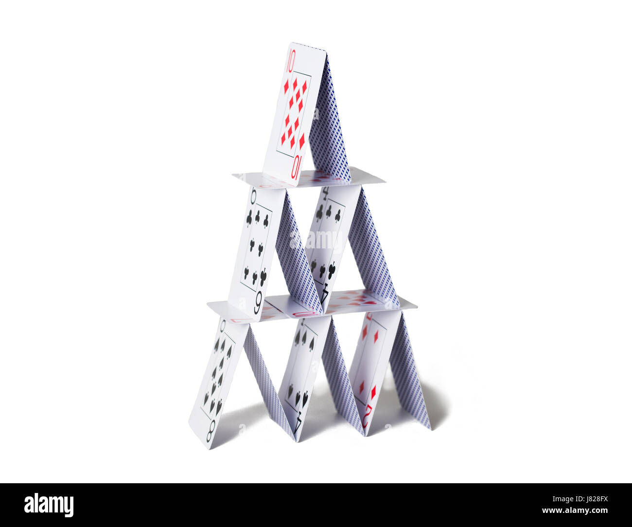 house of playing cards over white background Stock Photo