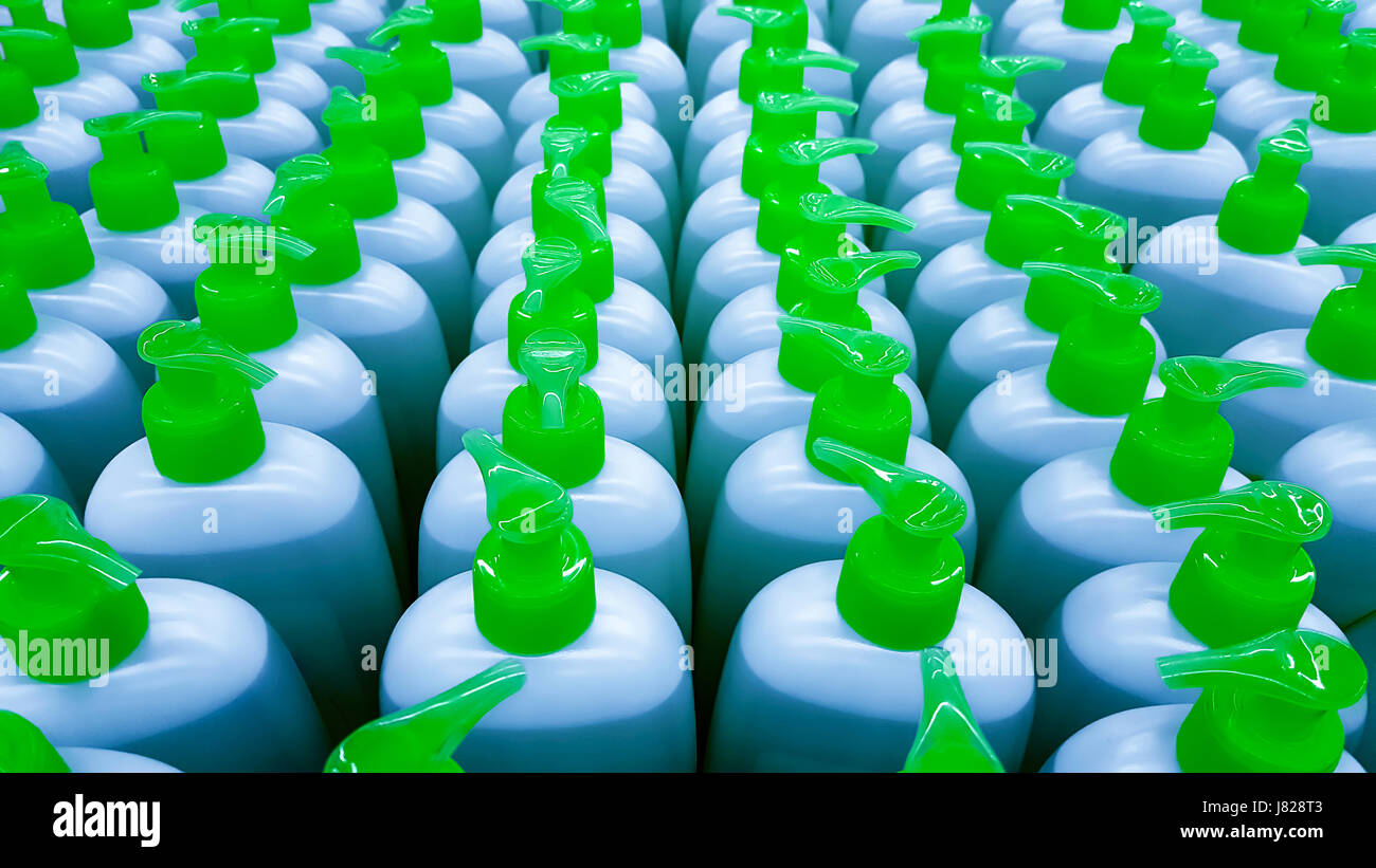 Color plastic bottles in a row. Background Stock Photo - Alamy