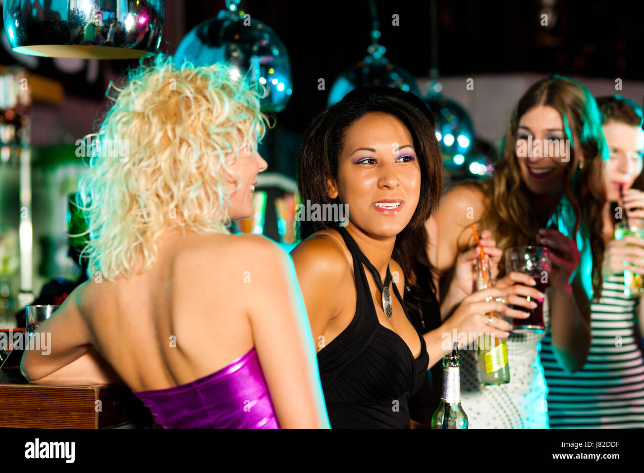 friends in a bar or disco Stock Photo - Alamy