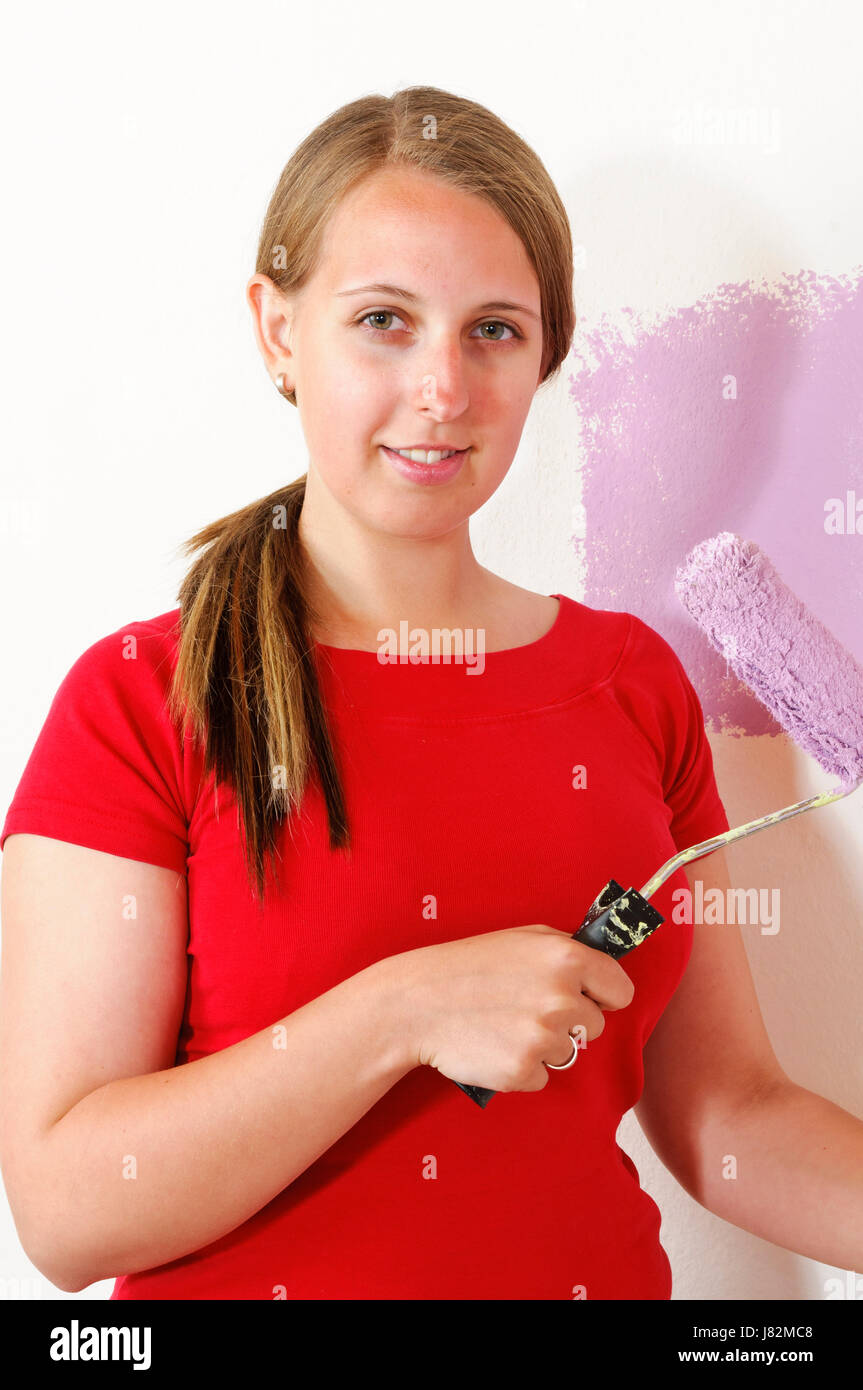 young woman painting a wall Stock Photo - Alamy