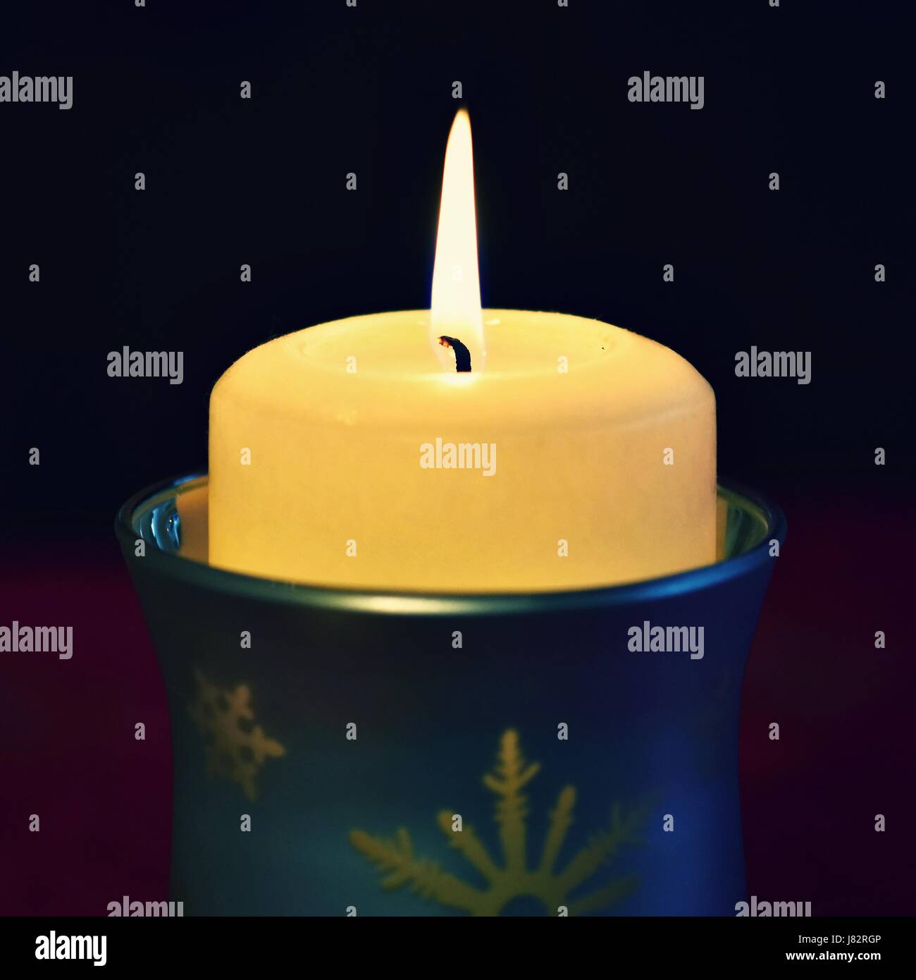 beautiful candle burning with a pure black background Stock Photo Alamy
