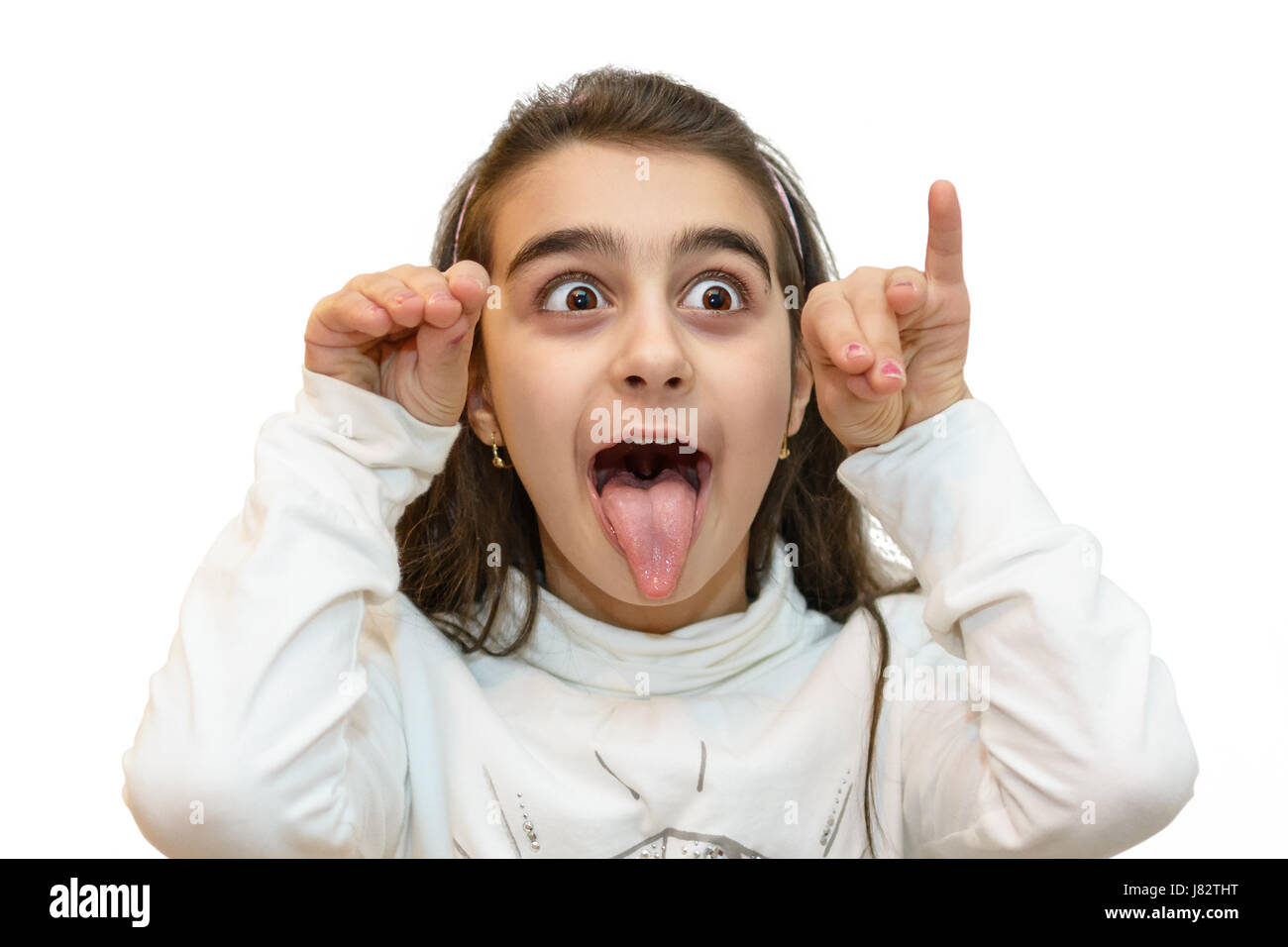 Portrait of young little girl with a grimace of derision Stock Photo