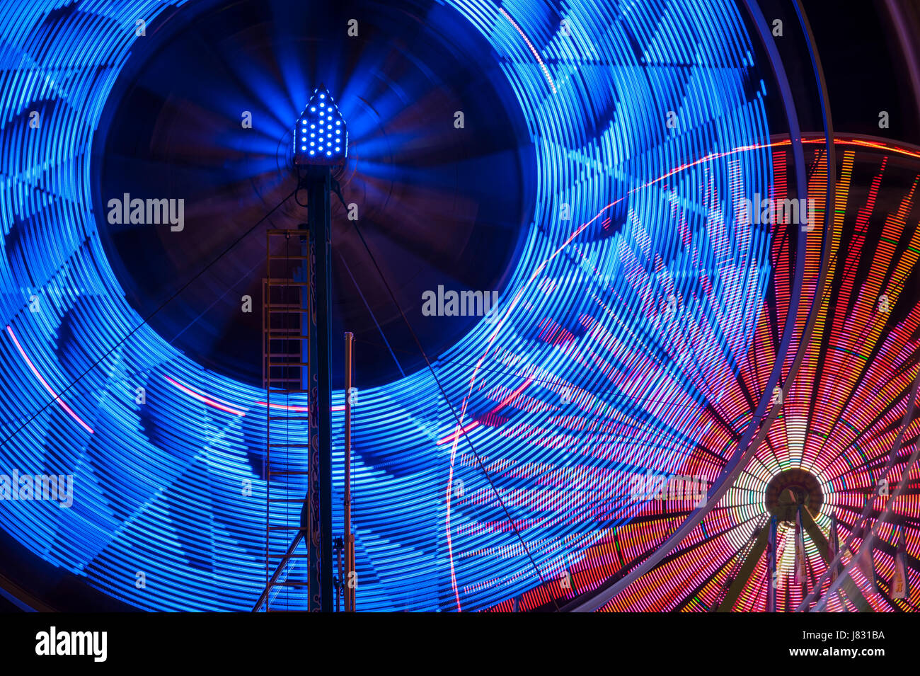 Ferris wheel in motion with multicolors and abstract patterns of colors