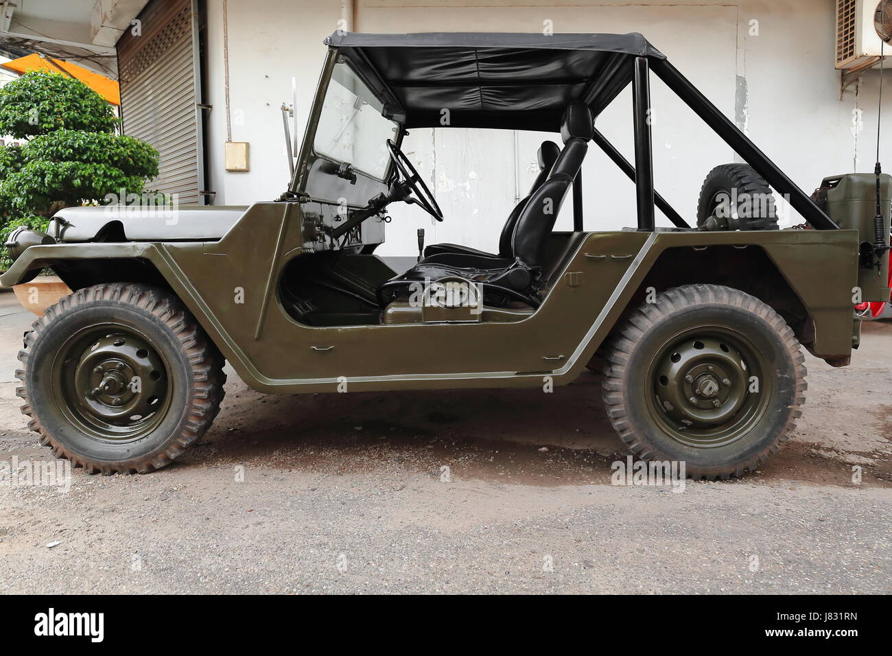 Old off-road four-wheel drive vehicle originally designed for the US army and navy and now serving civilian-agricultural-recreational purposes station Stock Photo