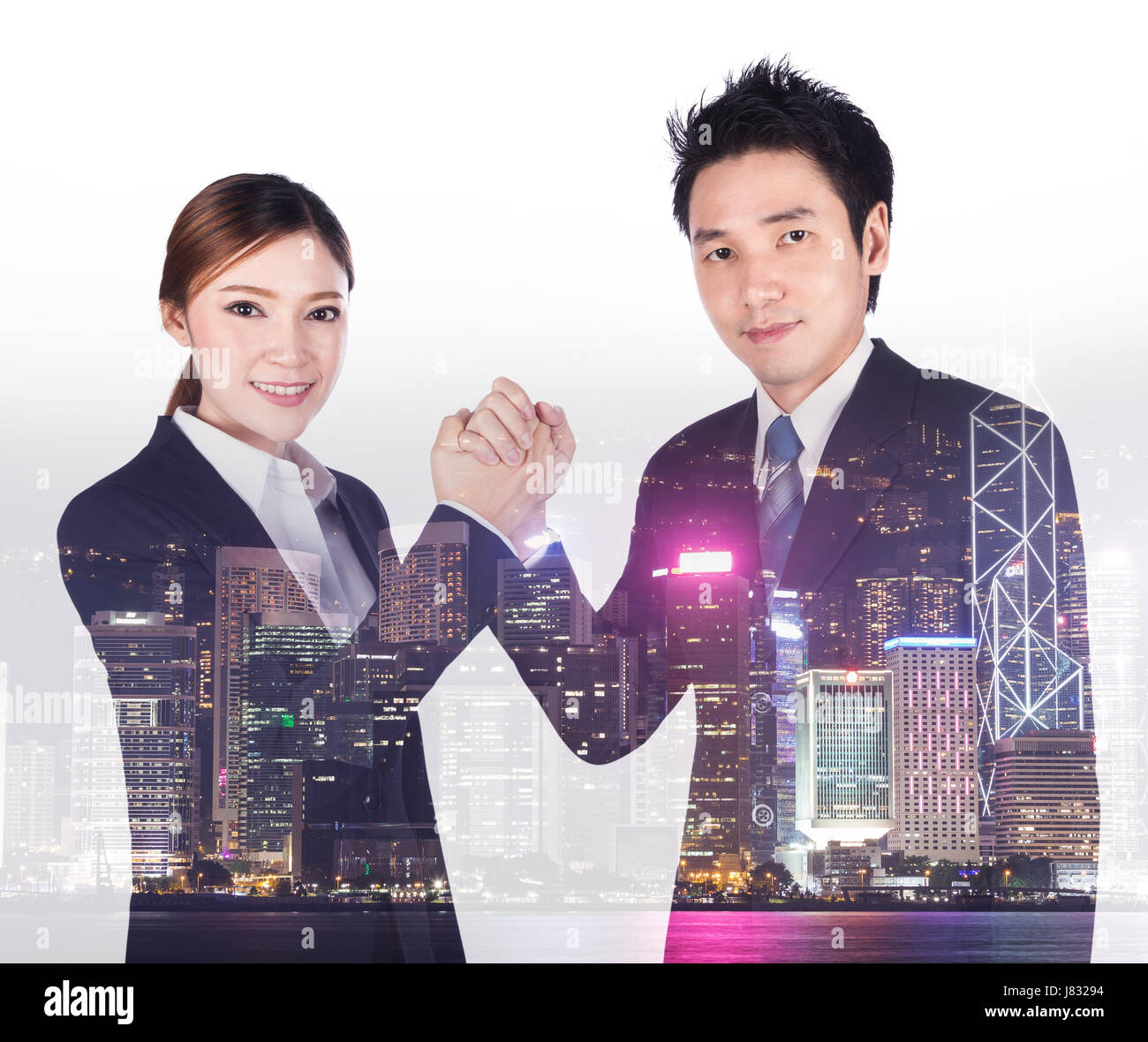double exposure of arm wrestling between businessman and businesswoman with a city background Stock Photo