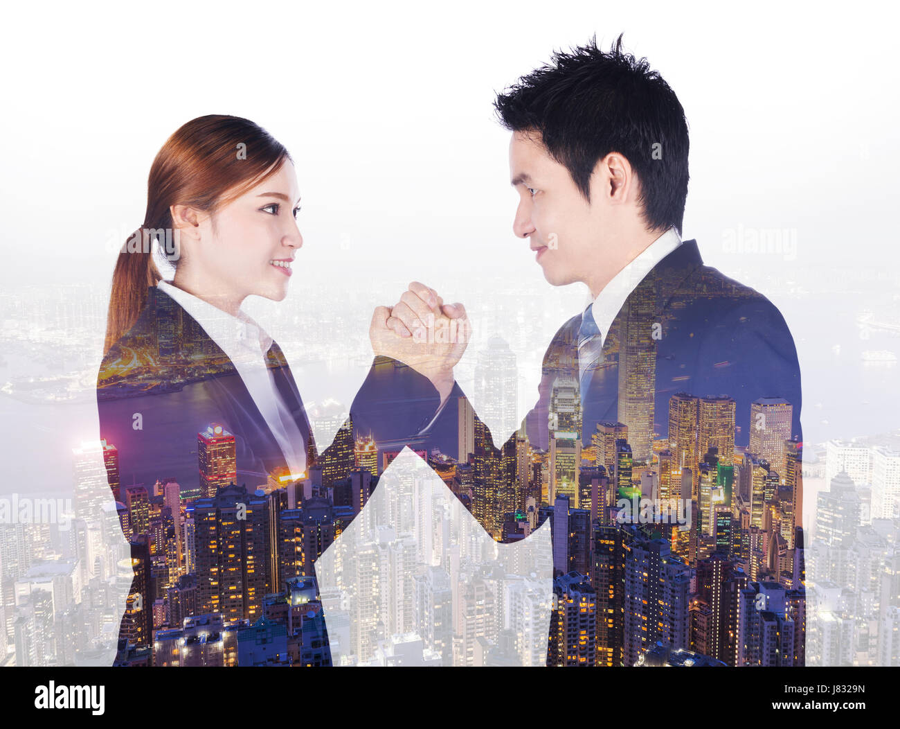 double exposure of arm wrestling between businessman and businesswoman with a city background Stock Photo