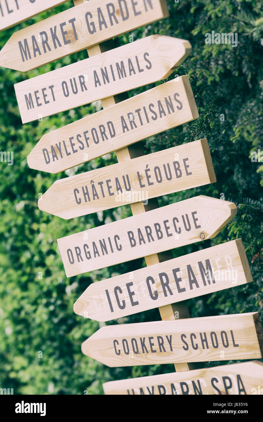 Daylesford Organic farm summer festival sign posts with added vintage filter. Daylesford, Cotswolds, Gloucestershire, England Stock Photo