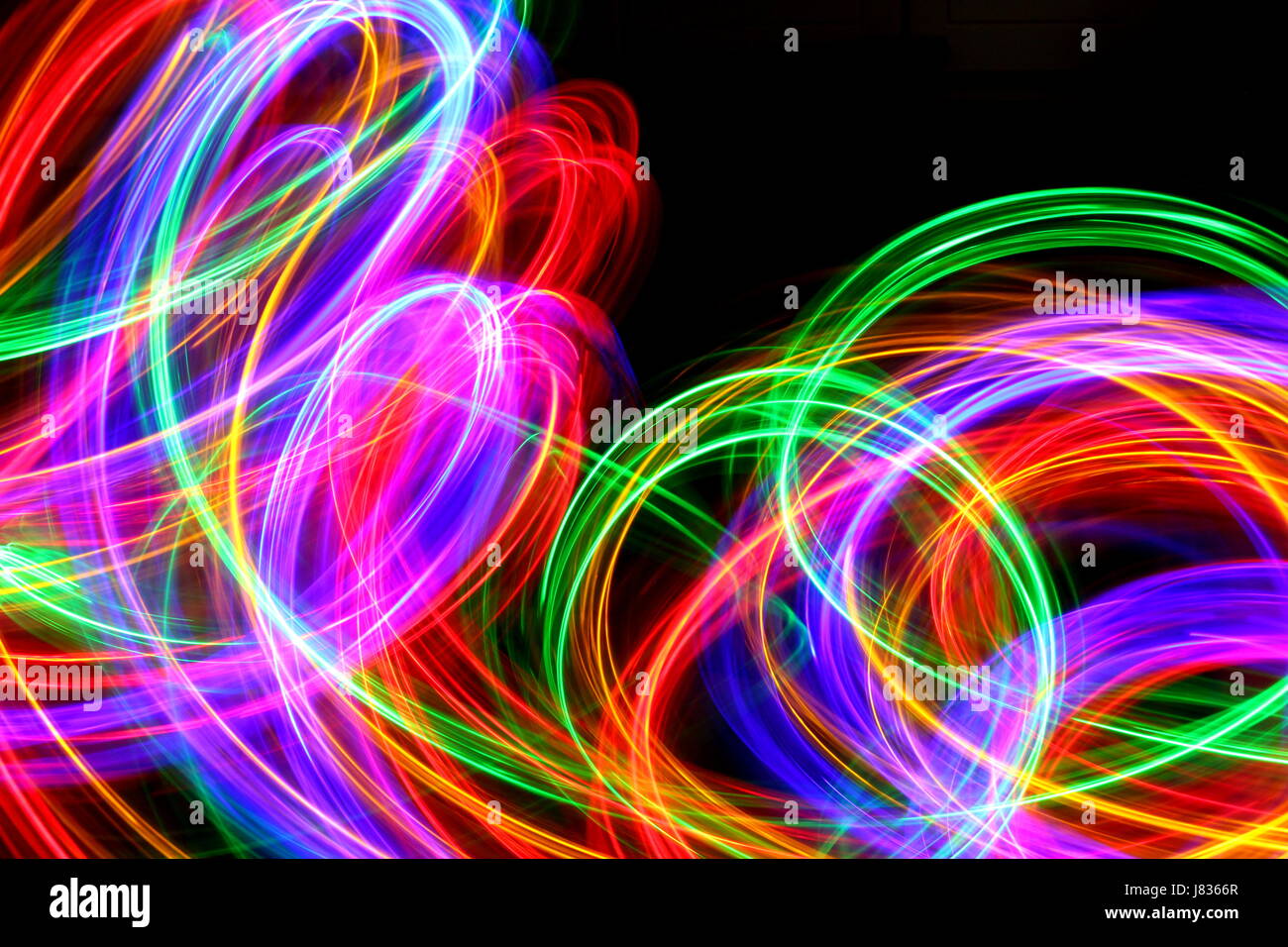 Multi Coloured Light Painting Photography, swirls and loops against a Stock Photo: 142670943 - Alamy