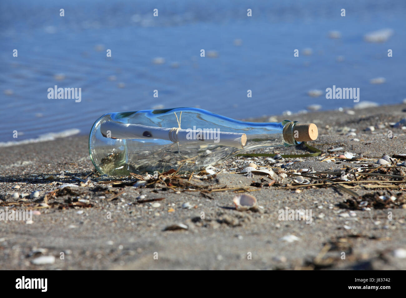 bottle post on the beach 1 Stock Photo - Alamy