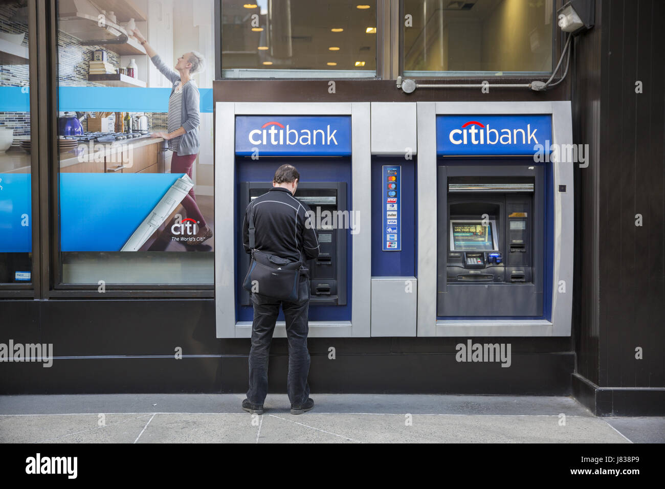 Man Uses A Citibank Atm On The Sidewalk In Midtown