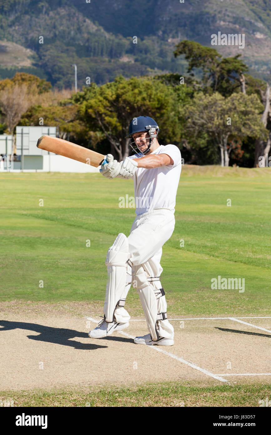Low Section Of Man Playing Cricket At Sports Field Stock, 57% OFF