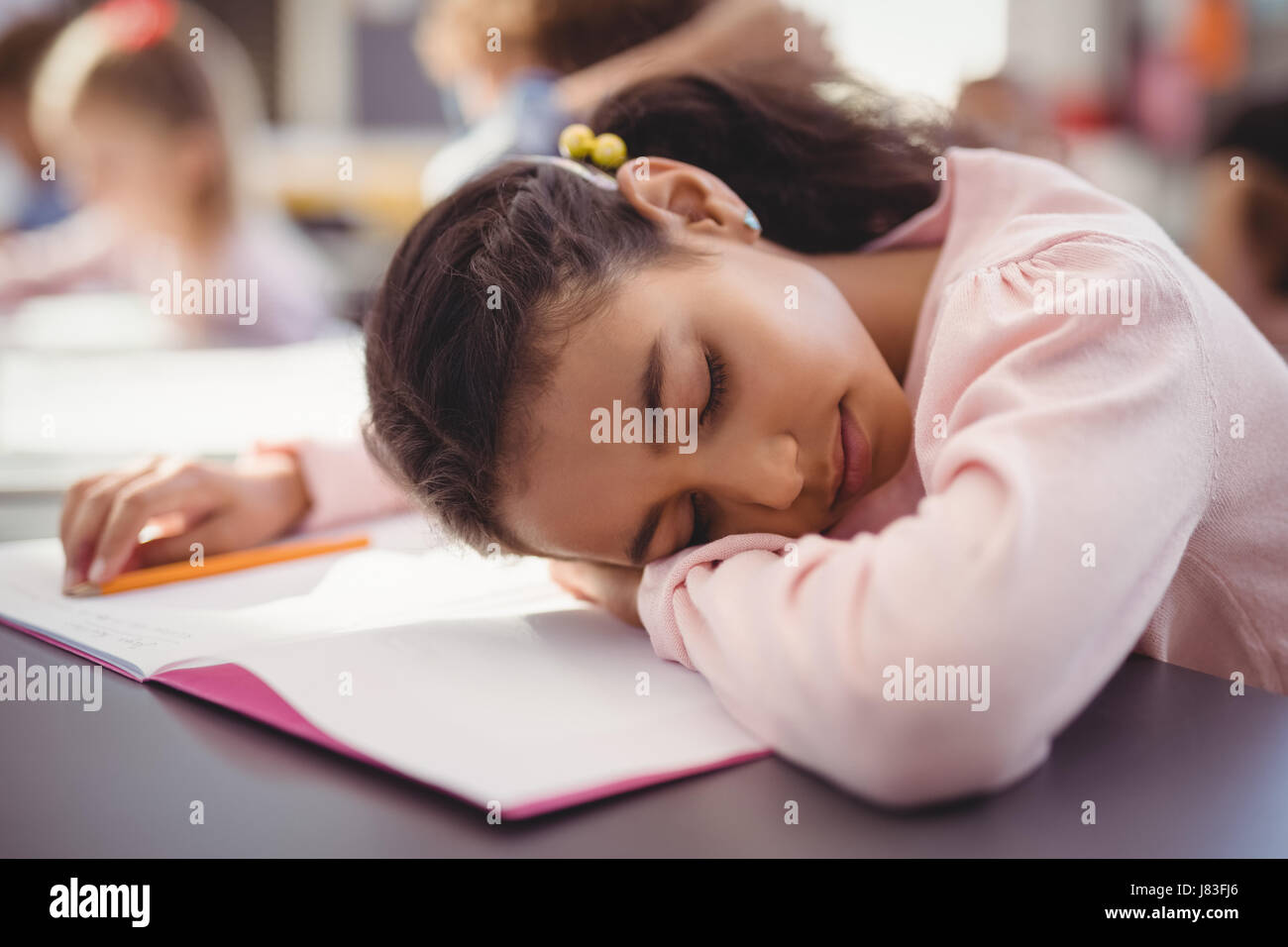 School girl sleeping in classroom hires stock photography and images