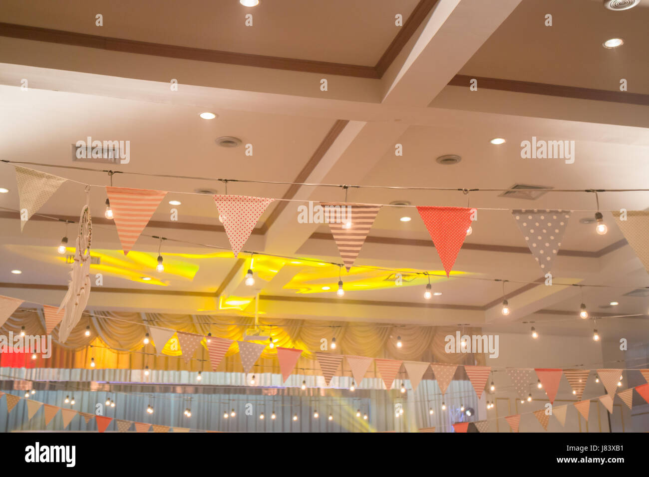 Multi colored triangle flags hanging indoor party, stock photo Stock ...
