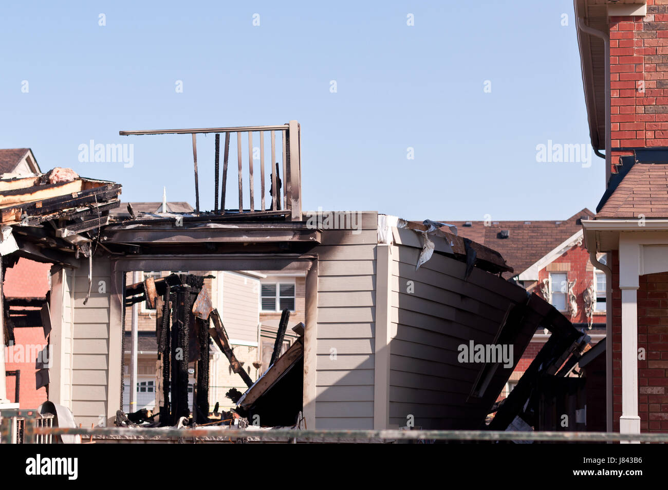 burnt burned explosion burst building home house building tree ...