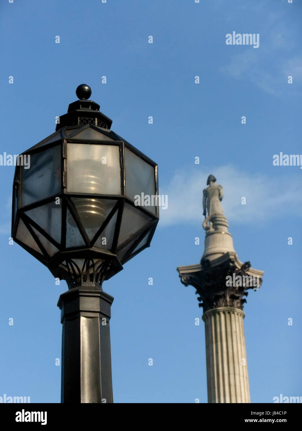 city town london shiner light lamp luminary column urban street road blue city Stock Photo