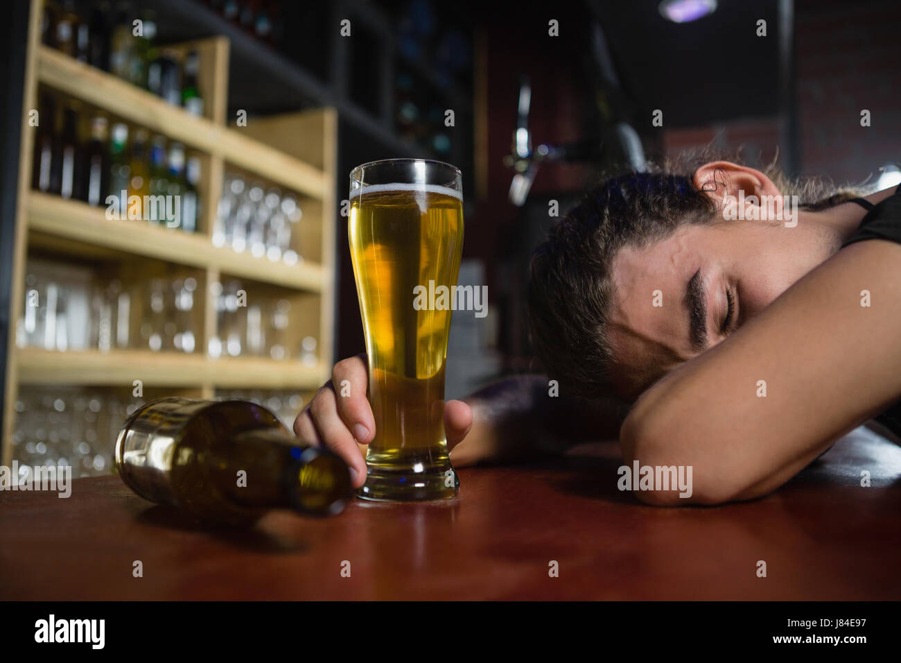 Drunk man sleeping on bar counter Stock Photo Alamy