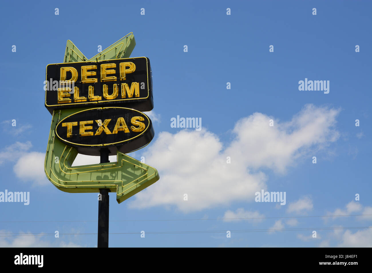 The iconic arrow sign to the Deep Ellum music and entertainment district east of downtown Dallas. Stock Photo