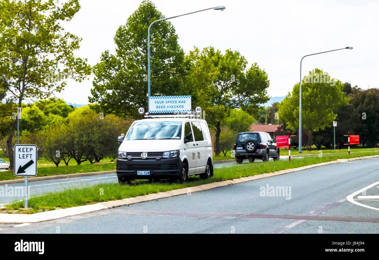 Speed radar van parked outside school to catch motorists who disobey the 40kph speed limit Stock Photo