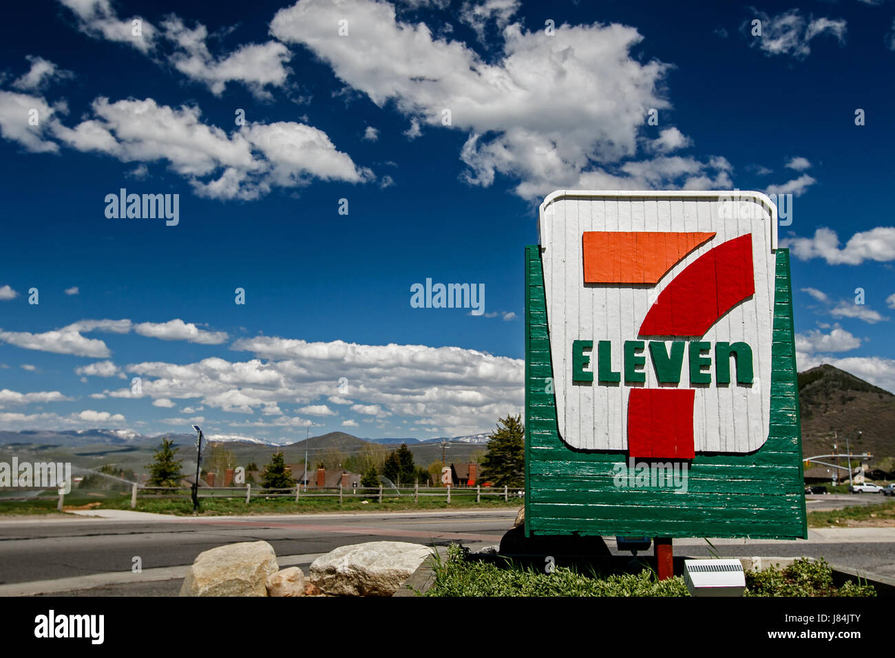 Park City, UT, May 12, 2017: 7-Eleven sign against a picturesque landscape is brightly lit by the sun. Stock Photo