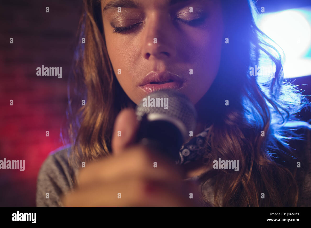 Close up of beautiful female singer performing at concert Stock Photo