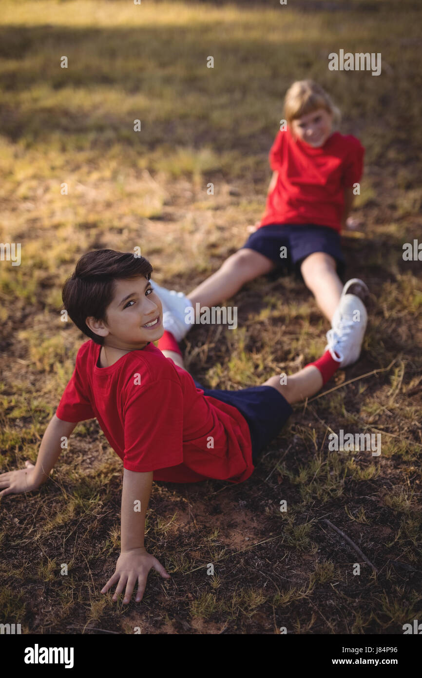 Happy kids together grass hi-res stock photography and images - Alamy