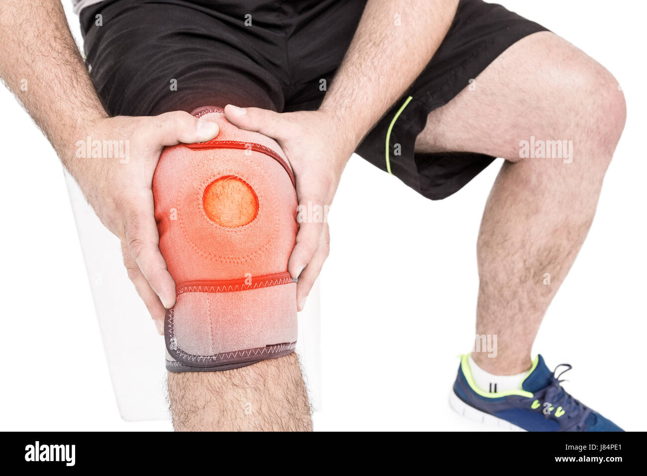 Digitally composite image of man suffering with knee inflammation Stock Photo
