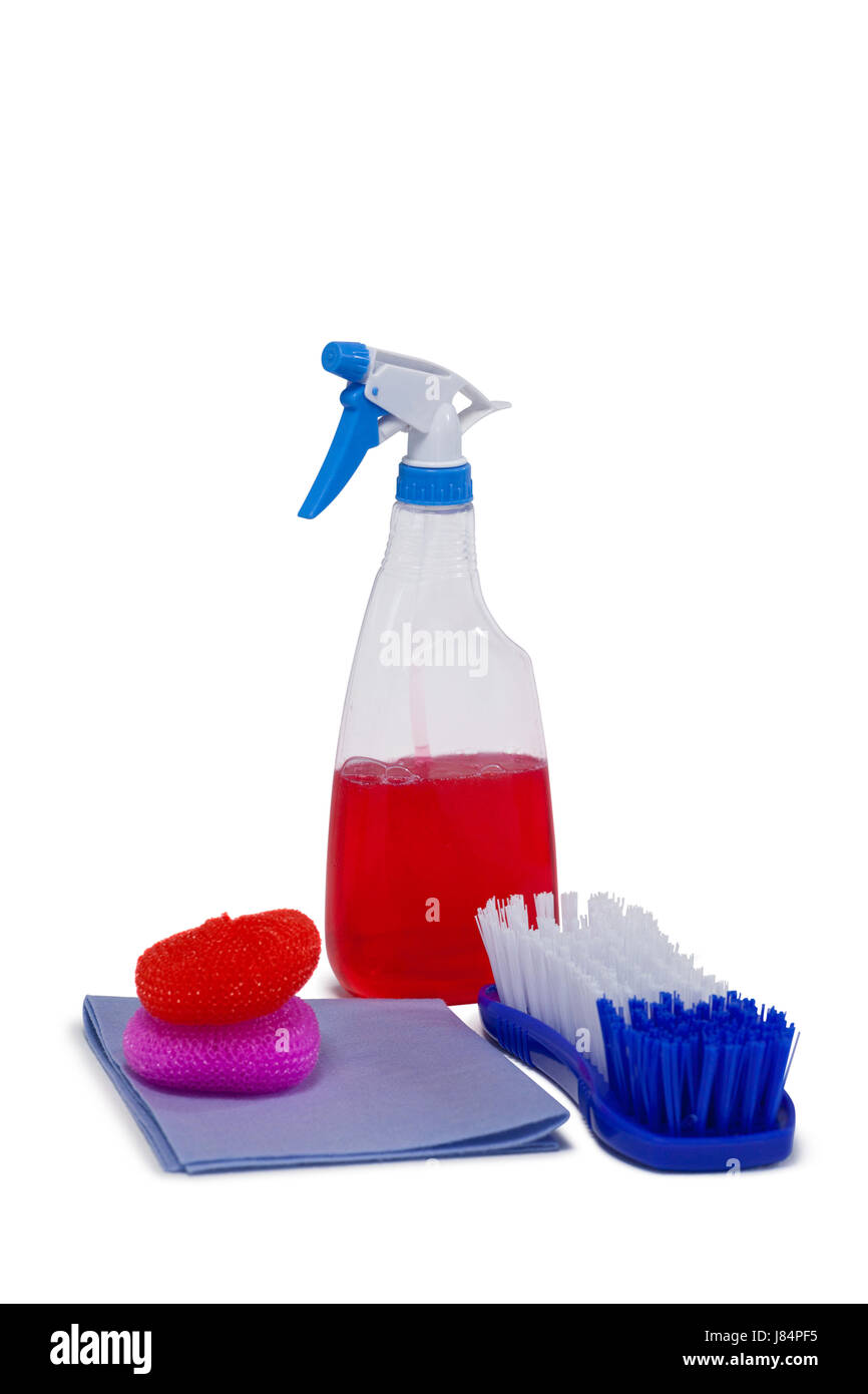 Detergent spray bottle, scrubber, napkin cloth and brush arranged on white background Stock Photo
