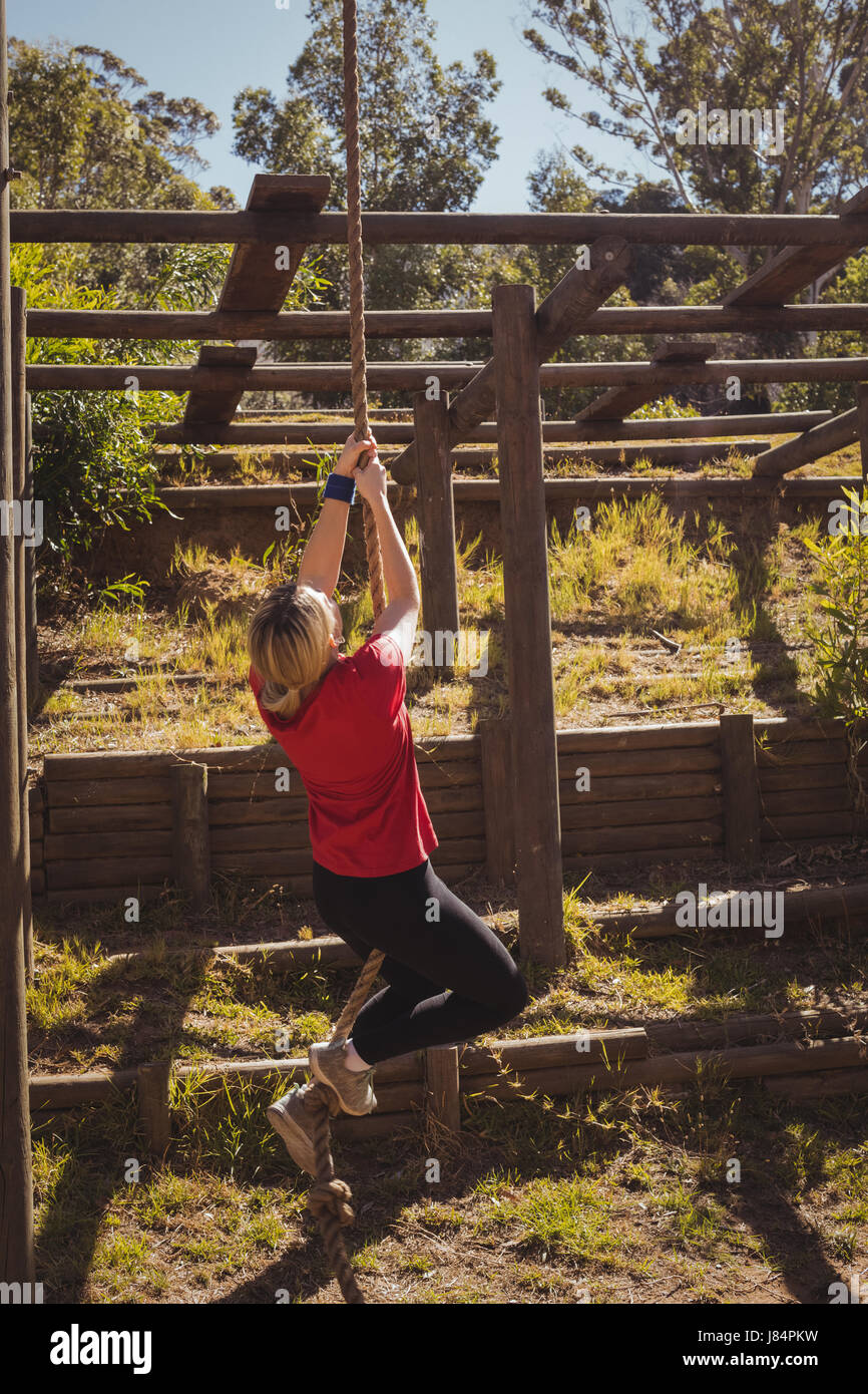 Young woman obstacle course climbing hires stock photography and images Alamy