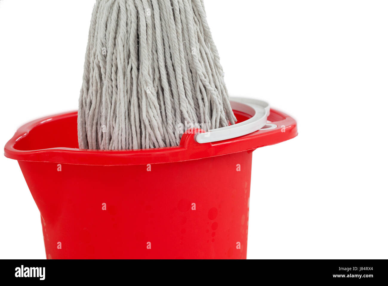 Closeup of mop in red bucket against white background Stock Photo Alamy
