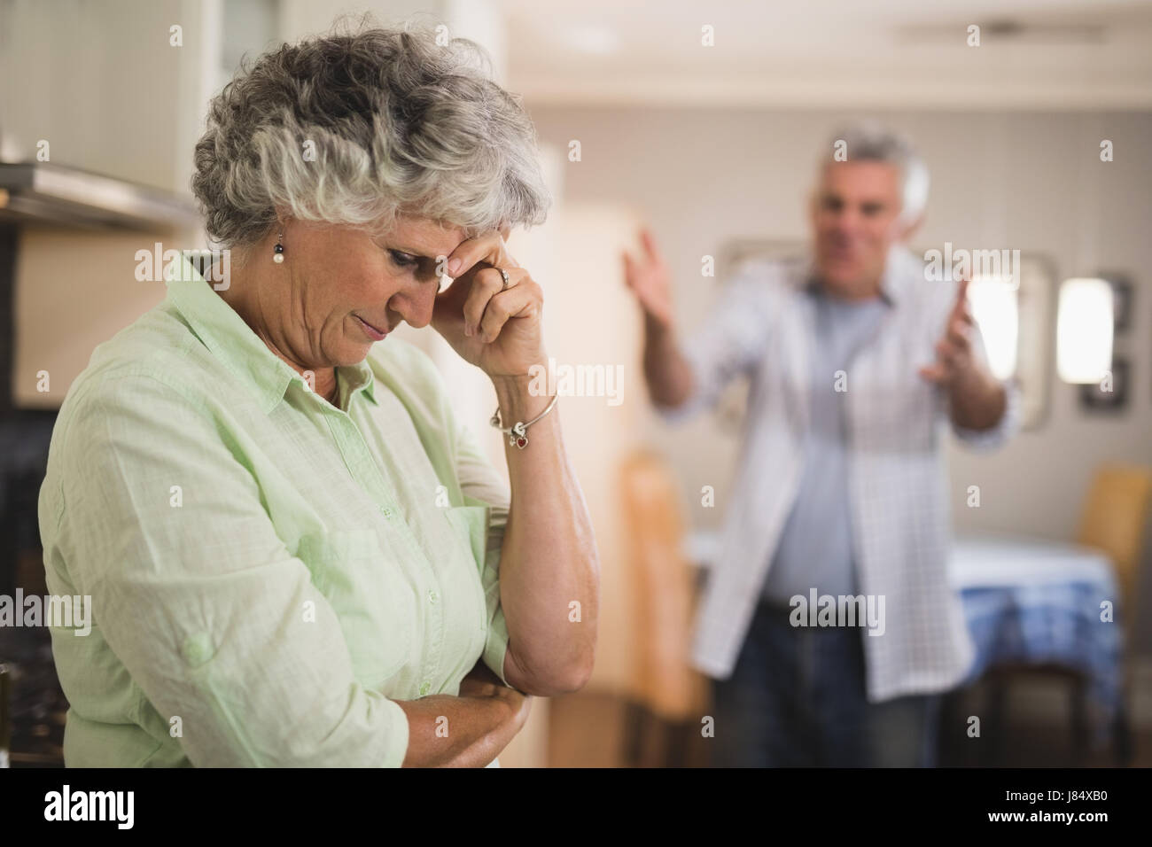 Angry senior man yelling on senior woman at home Stock Photo - Alamy