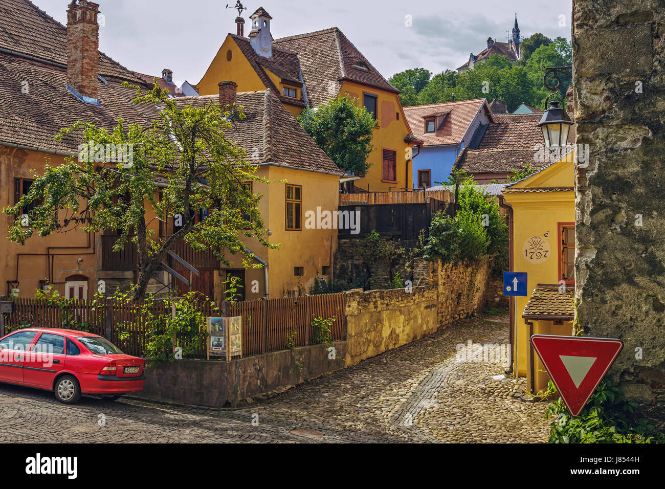 Sighisoara, Romania - July 26, 2014: Old residential district in the historic center of Sighisoara, one of the few still inhabited citadels in Europe. Stock Photo