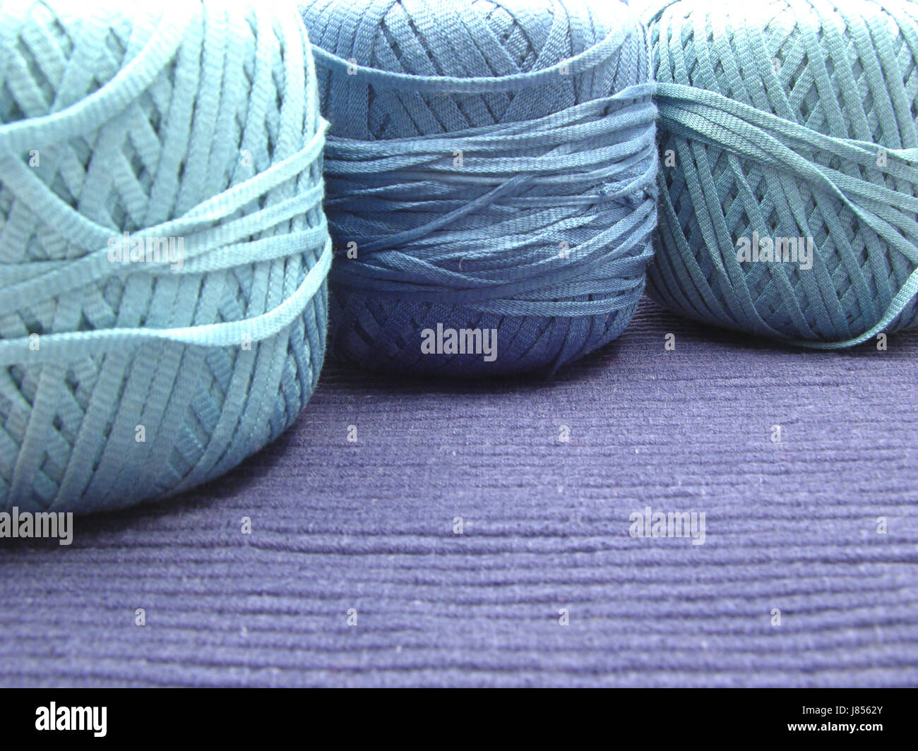 blue brown brownish brunette wool knit handicraft cotton yarn ball of wool Stock Photo