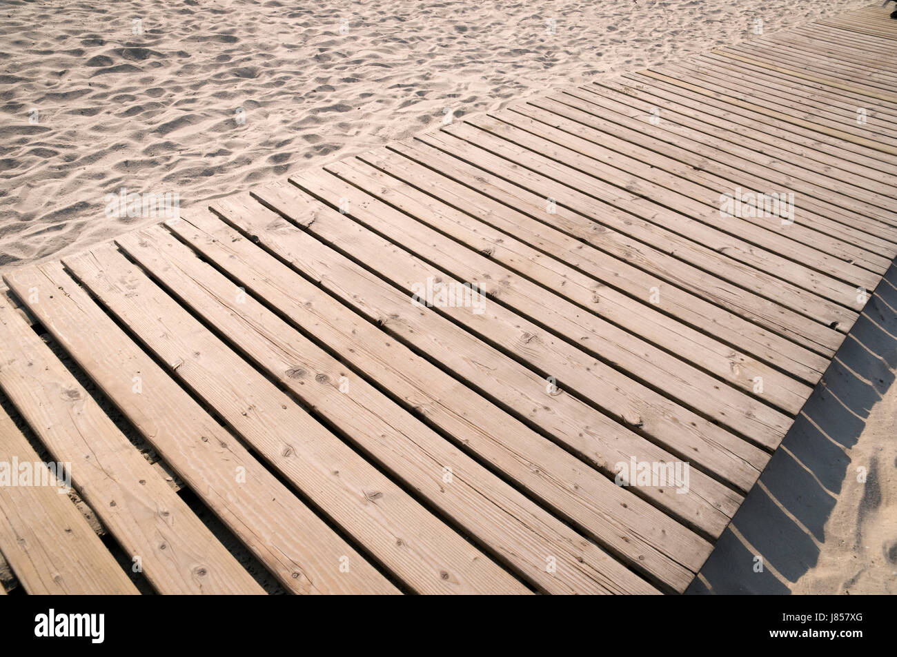 wooden way on the sand Stock Photo