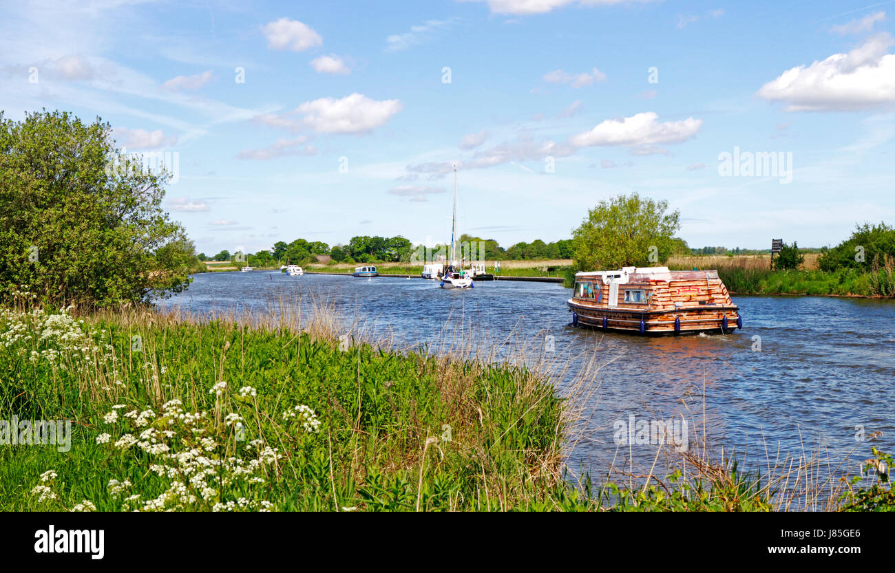 A view of boat traffic on the River Bure in the Broads National Park at South Walsham, Norfolk, England, United Kingdom. Stock Photo