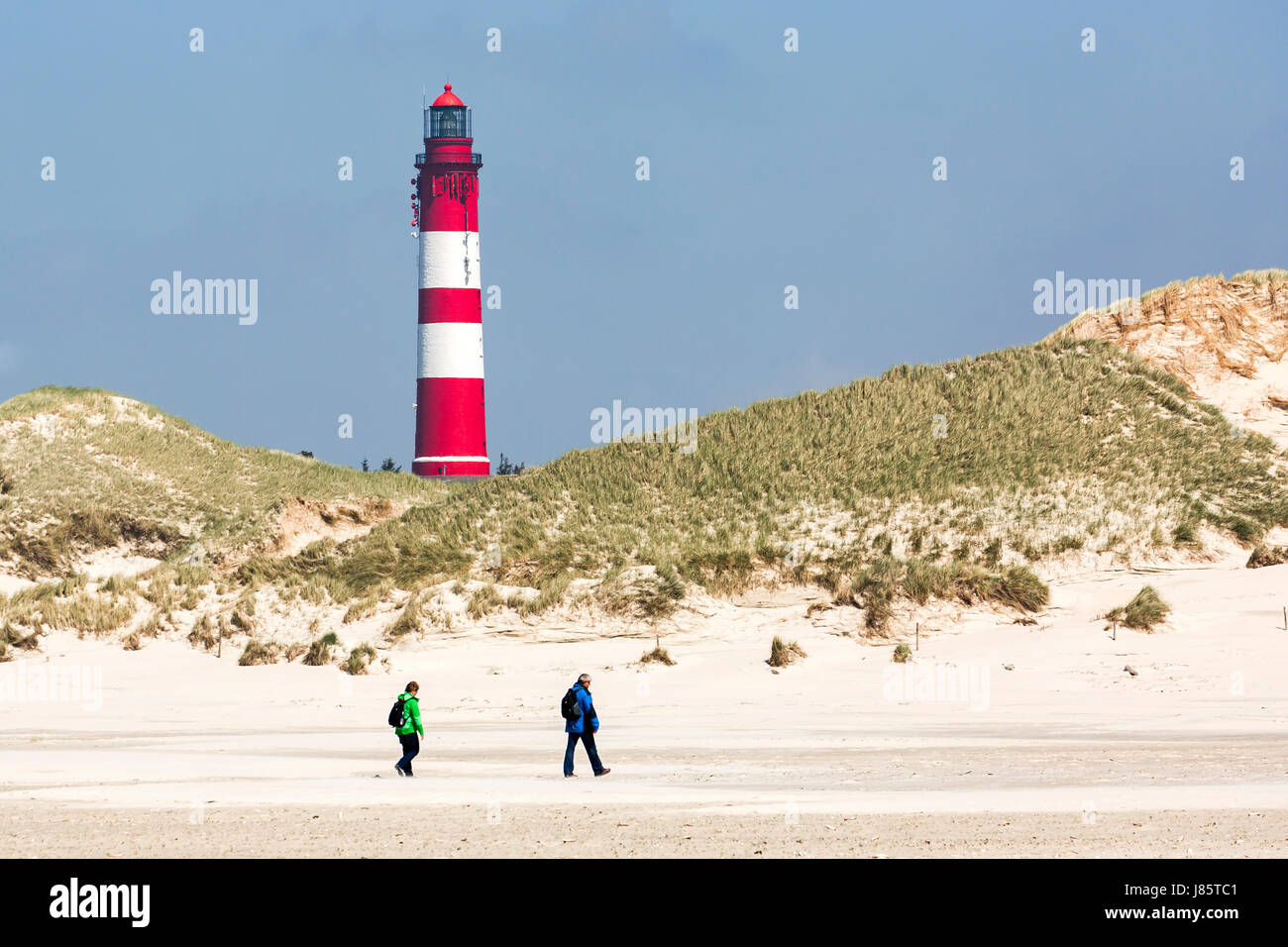 Strollers on the beach, lighthouse, Amrum, North Frisian Islands, Schleswig-Holstein, Germany Stock Photo